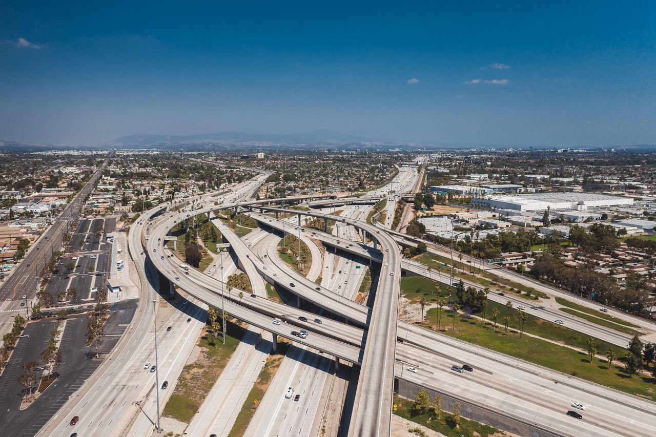 Aerial shot of sprawling highway overpasses in Los Angeles, capturing urban landscape and infrastructure.
